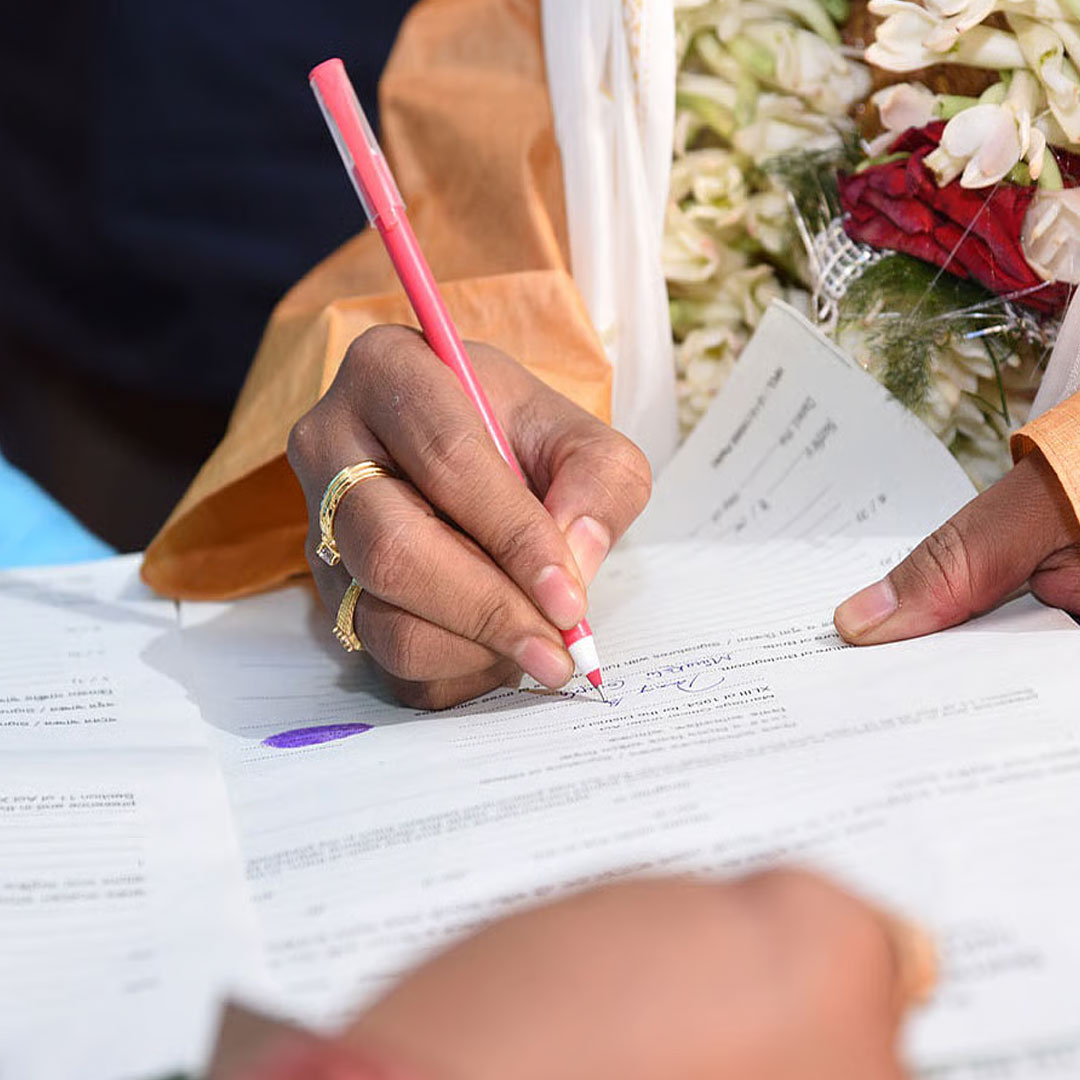 Couple embracing during an outdoor wedding ceremony
